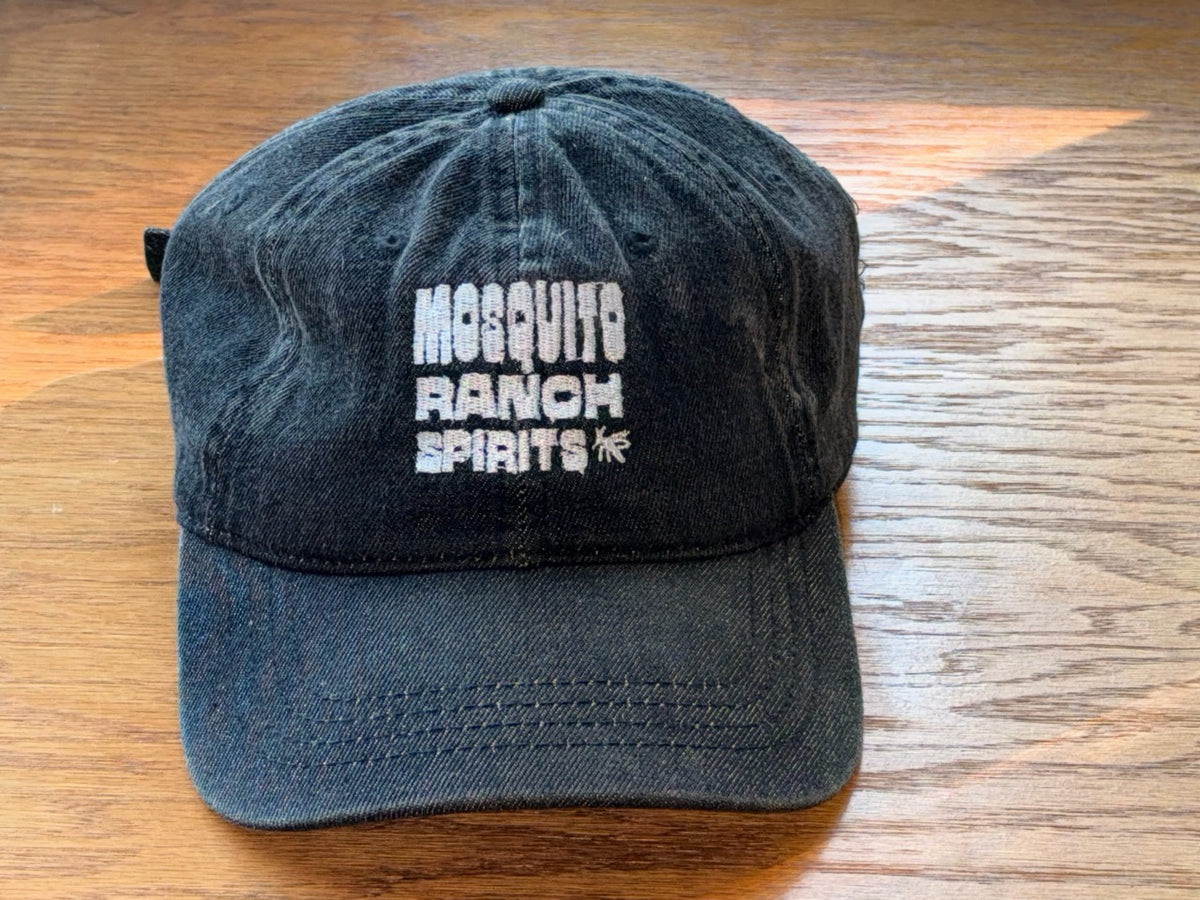 Black denim Mosquito Ranch Spirits cap with a white embroidered logo
